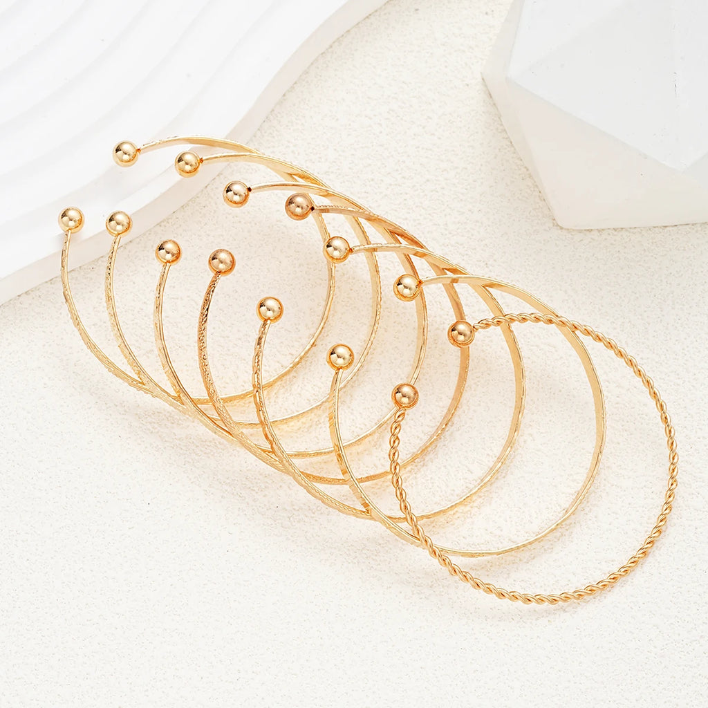 Golden Rebel Stackable Bracelet Set – 7 Piece Cuff Bangle Collection