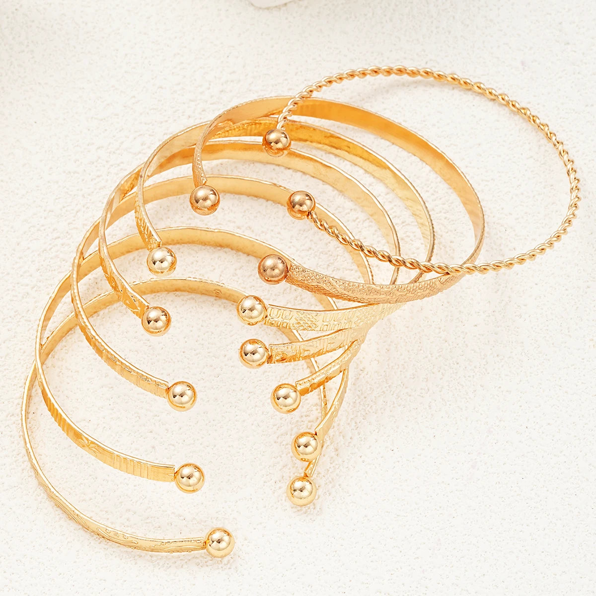 Golden Rebel Stackable Bracelet Set – 7 Piece Cuff Bangle Collection