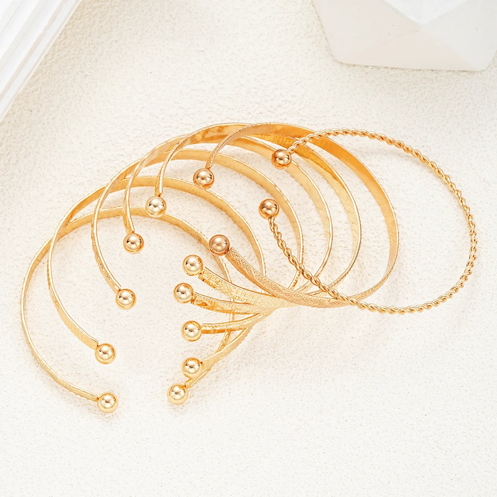Golden Rebel Stackable Bracelet Set – 7 Piece Cuff Bangle Collection