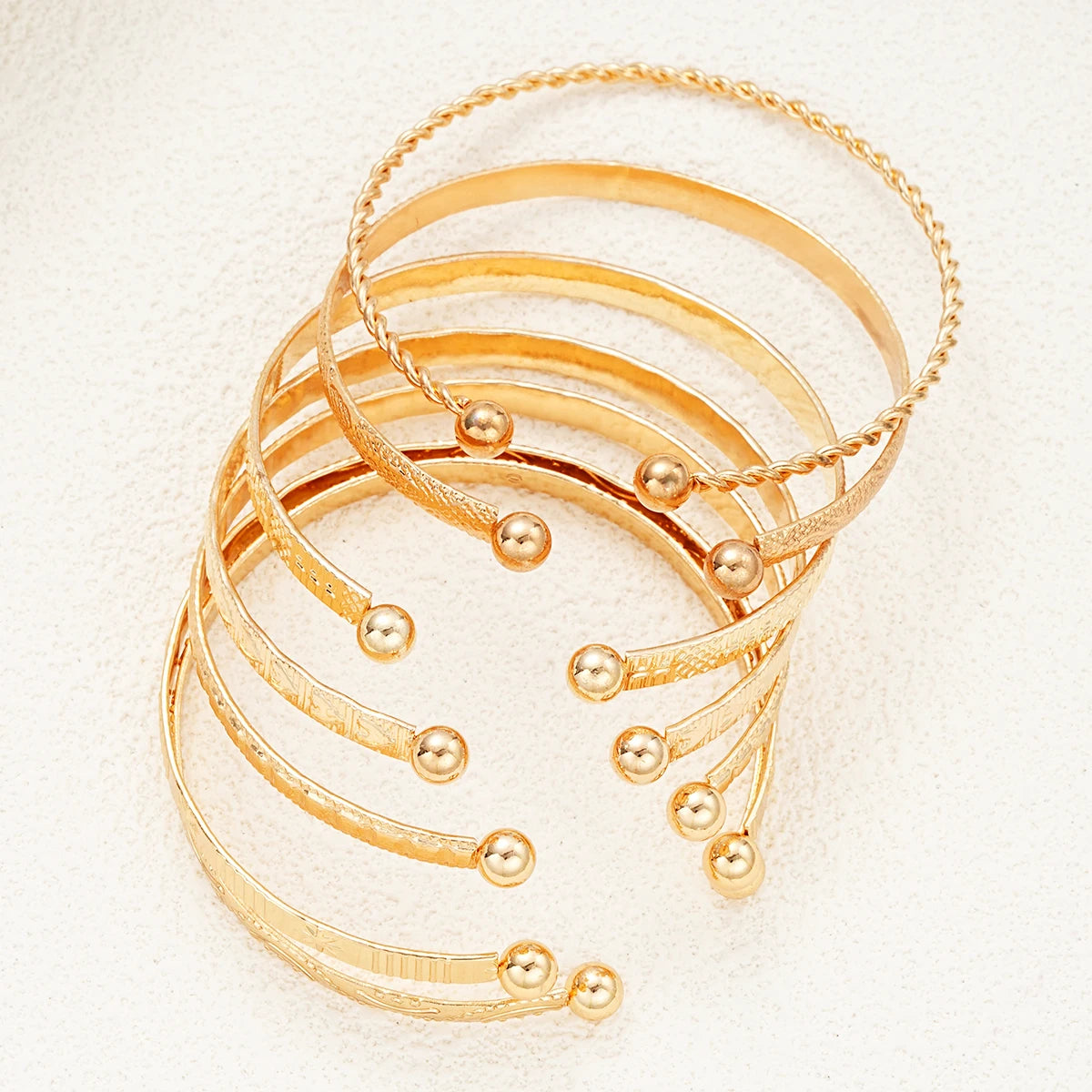 Golden Rebel Stackable Bracelet Set – 7 Piece Cuff Bangle Collection